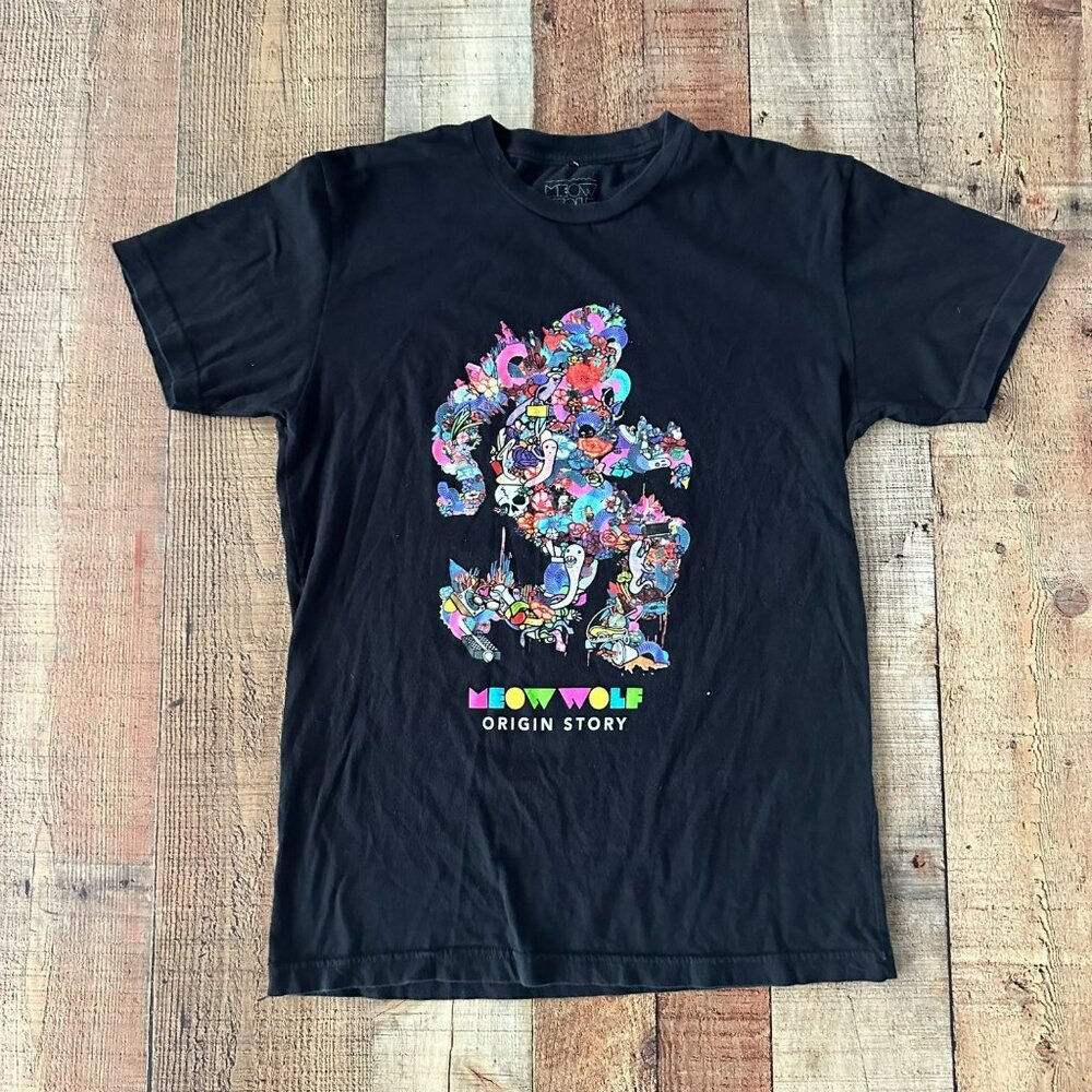 Meow Wolf Women size small Origin Story Graphic Short Sleeve TShirt Black Cotton
